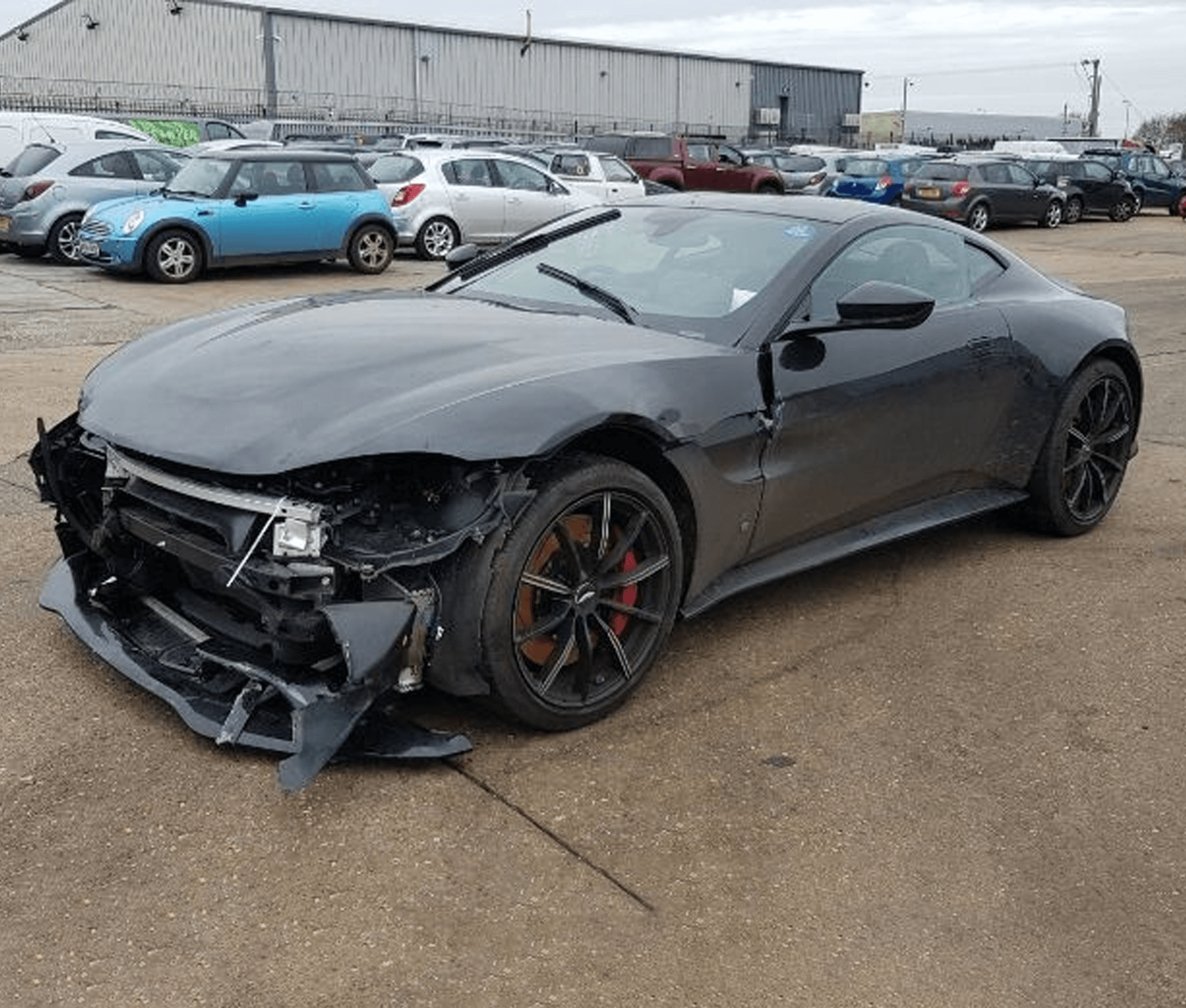 Damaged Aston Martin with front-end collision damage — we buy every model, in any condition